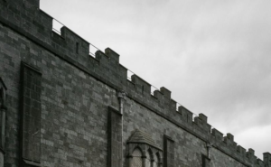 A view of the imposing stone walls of Kilkenny Castle.