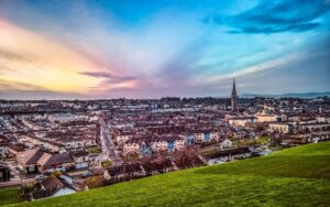 Cityscape of Derry with a prominent tower in the skyline