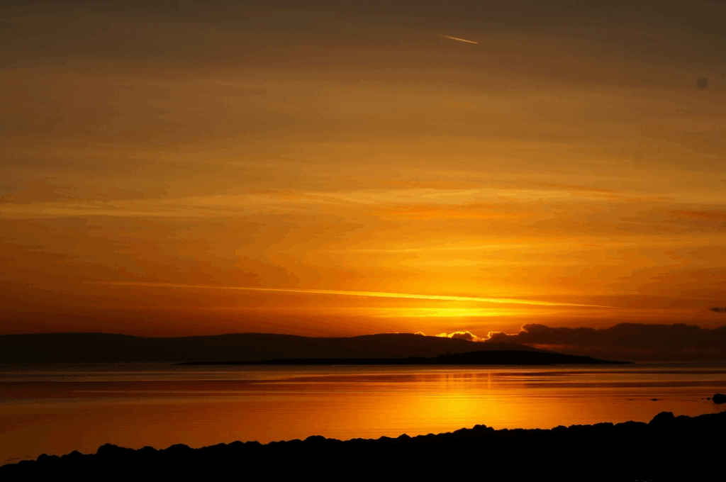 Silhouette of a mountain range on the Wild Atlantic Way during a dramatic sunset