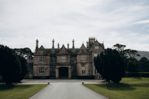 Traditional Irish manor house with gothic architectural features and landscaped grounds