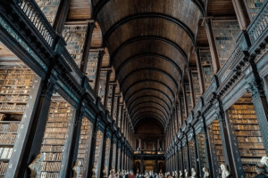 Tourists exploring the interior of a library in Dublin.