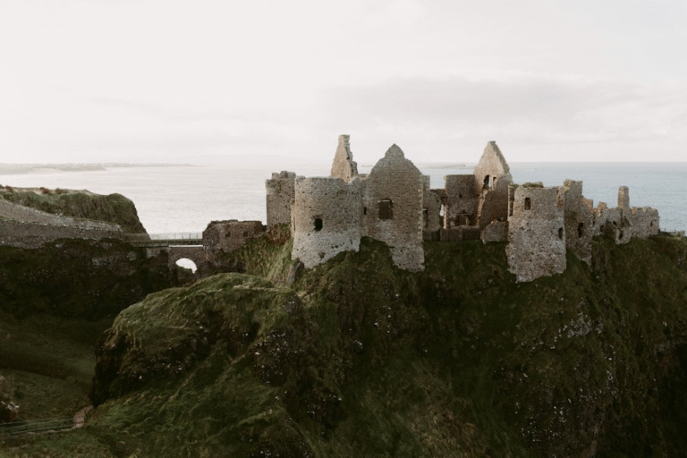 old medieval ruins of a castle by the ocean in Ireland