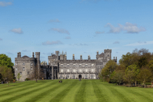 view of the Kilkenny Cathedral with a green field in front of it