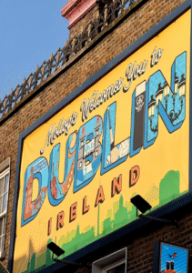 This image shows a Dublin welcome sign on top of a building.