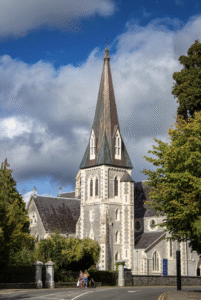 This photo shows a traditional Irish stone church surrounded by green countryside.