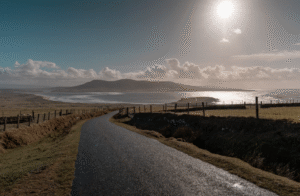 This photo shows a scenic coastal road in the Irish countryside.