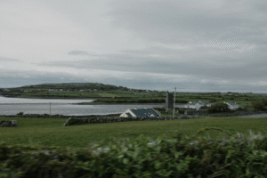 Idyllic Irish countryside overlooking coast with stone cottages