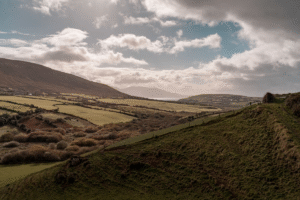 Majestic Irish rolling hills under dramatic cloudy skies